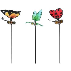 PERSONNAGE SUR PIC EN METAL ET VERRE